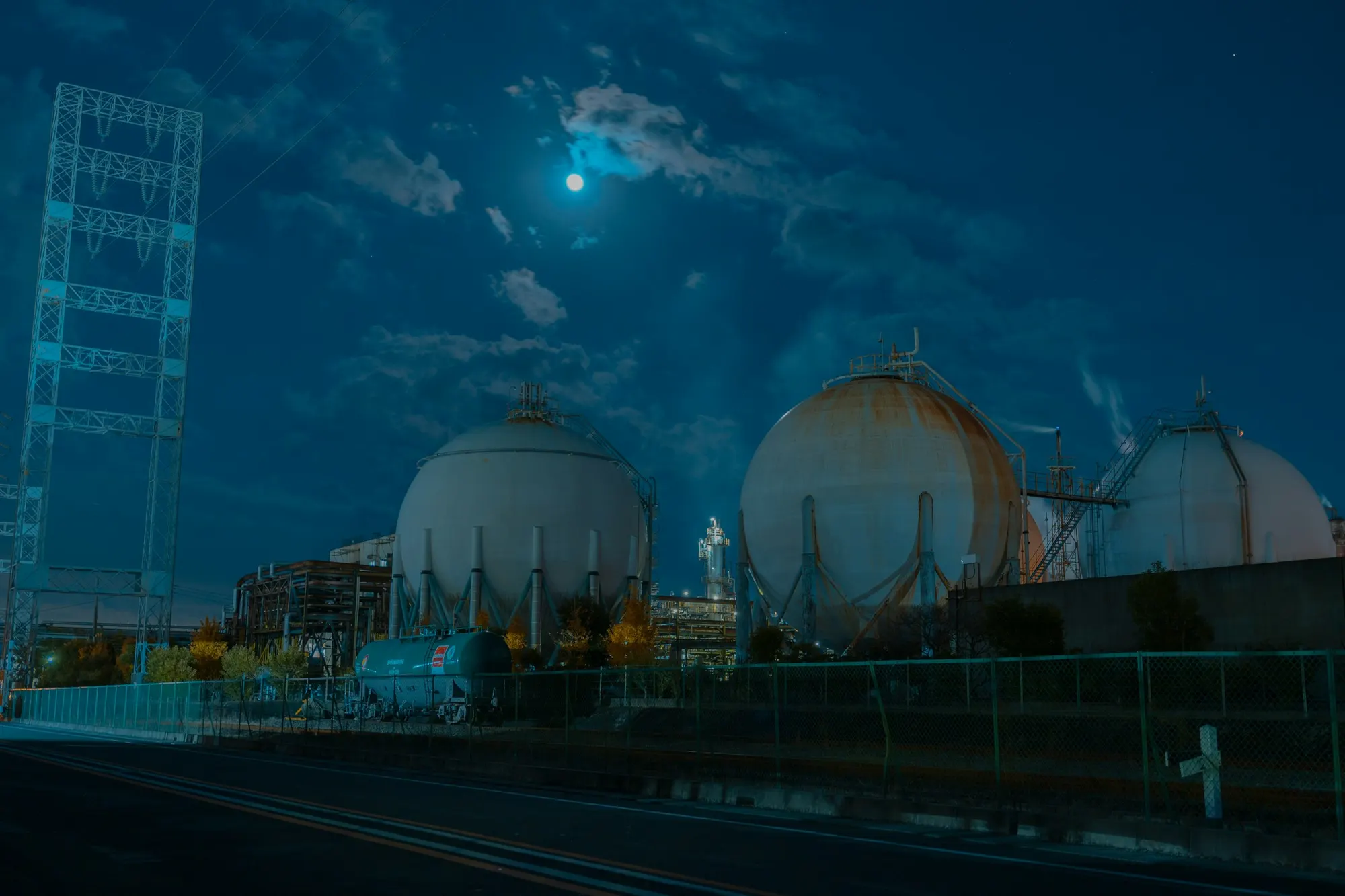 Spherical LPG storage tanks at an industrial terminal at night