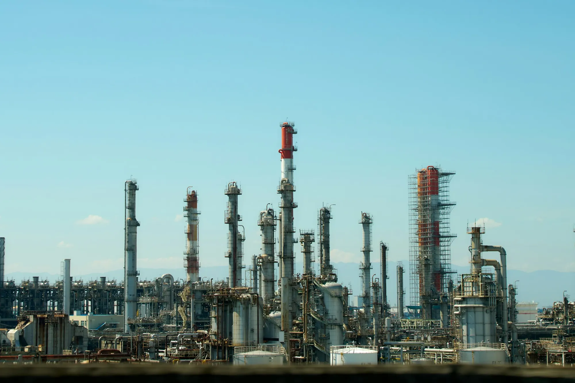 A petroleum refinery with distillation towers and pipework